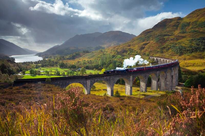 UK, Scotland, Highland, Loch Shiel, Glenfinnan, Glenfinnan Railway Viaduct, part of the West Highland Line, The Jacobite Steam Train, made famous in JK Rowling's Harry Potter as the Hogwarts Express. Getty Images