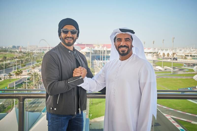 Bollywood star Ranveer Singh being presented his UAE golden visa in Abu Dhabi by Mohamed Abdalla Al Zaabi, the chief executive of Miral. Photo: Yas Island