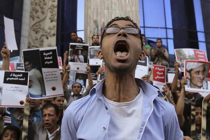 Members of the April 6 movement shout slogans with activists against the government as they protest against the detention of several members of their movement in front of the Press Syndicate building in Cairo. Mohamed Abd El Ghany / Reuters