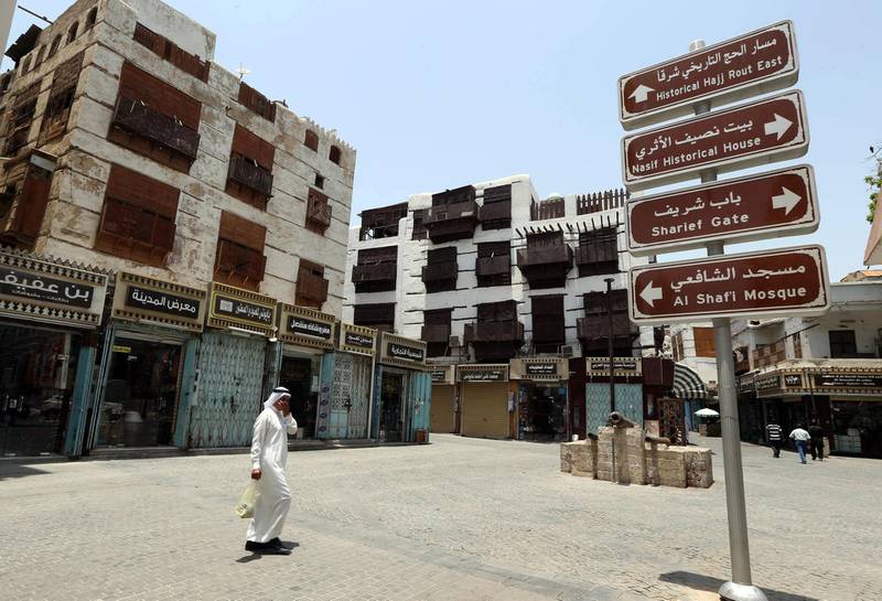 Windows covered with wooden screens known as "mashrabaiya" adorn traditional buildings in the old  city of the Red Sea port city of Jeddah on June 22, 2014. UNESCO's World Heritage Committee, meeting in the Qatari capital Doha on June 21, 2014, has inscribed the old city of Jeddah and the Gate of Mecca on the World Heritage List.   AFP PHOTO/STR / AFP PHOTO / STR
