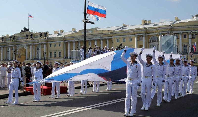 Russian President Vladimir Putin watches the Navy Day parade on the Neva river in Saint Petersburg. AFP / SPUTNIK / Mikhail KLIMENTYEV