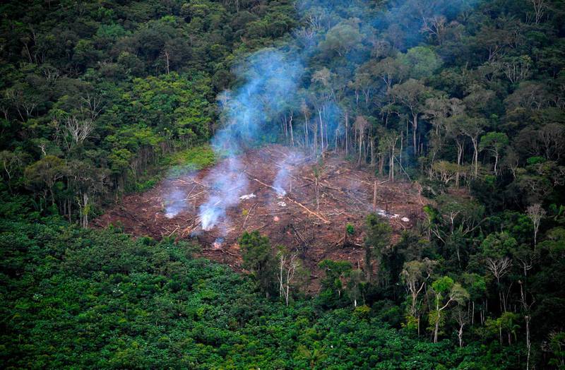TOPSHOT - General aerial view of illegal deforestation at the Natural National Park in La Macarena, Meta Department, Colombia, on September 3, 2020.  Soldiers carry out the sixth phase of the Artemisa Campaign to combat deforestation in the Amazonian departments of southeastern of the country. / AFP / Raul ARBOLEDA
