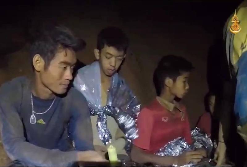 A video grab handout made available by Thai Royal Navy shows some of the members of the trapped football team. Royal Thai Navy / EPA
