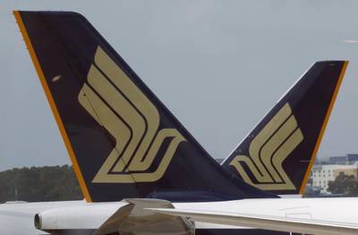 FILE PHOTO - Singapore Airlines (SIA) planes sit on the tarmac in Singapore's Changi Airport March 3, 2016. REUTERS/Edgar Su/File Photo