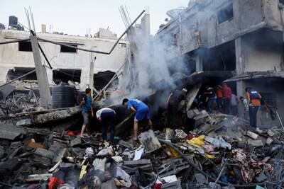 Palestinians search for casualties in Khan Younis. More than 1,500 people have been killed and injured by Israeli attacks on Gaza in the past week. Reuters