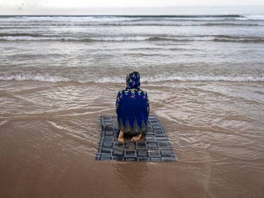 The best photos of the week: From a prayer at sea to wrestling on a train