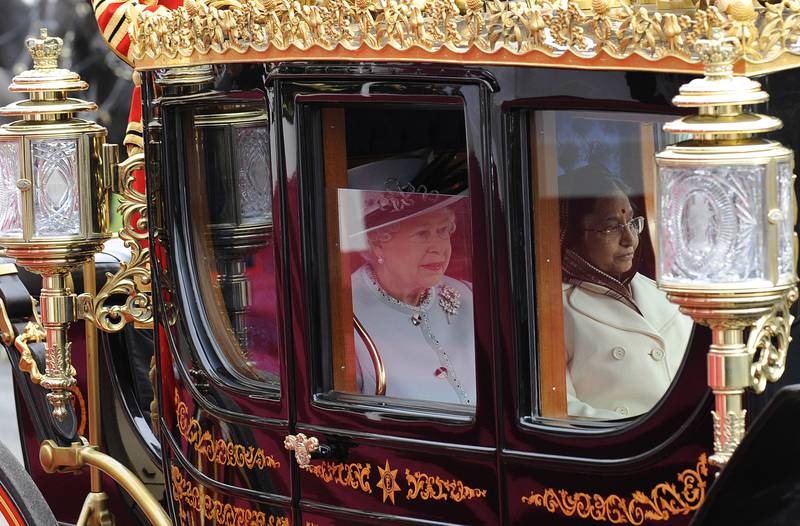 Queen Elizabeth with the former president of India, Prathibha Devi Singh Patil, as she arrived in Windsor for a state visit in October 2009. Getty Images