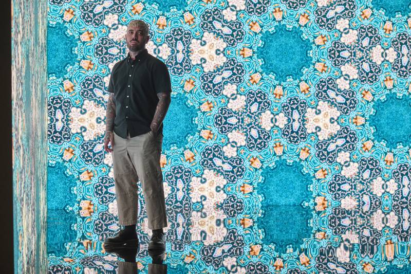 Artist Jason Seife with his digital animation work at ICD Brookfield Place. Photo: Ismail Noor