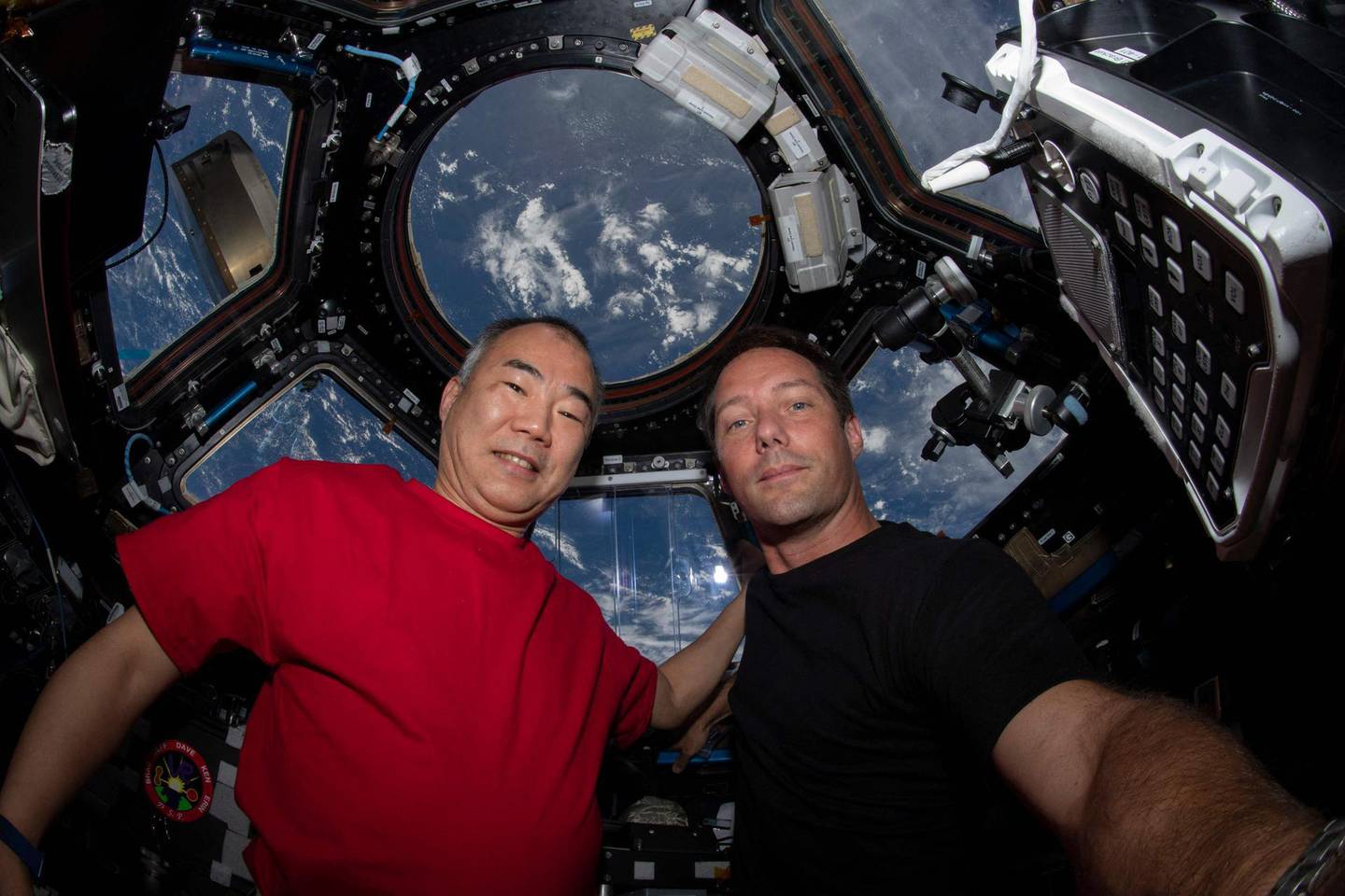 TOPSHOT - This NASA handout photo obtained May 2, 2021 shows Expedition 65 Flight Engineers Soichi Wakata(L) of the Japan Aerospace Exploration Agency and Thomas Pesquet of the European Space Agency as they pose on April 28, 2021 for a portrait inside the cupola, the International Space Station's "window to the world." RESTRICTED TO EDITORIAL USE - MANDATORY CREDIT "AFP PHOTO /NASA/HANDOUT " - NO MARKETING - NO ADVERTISING CAMPAIGNS - DISTRIBUTED AS A SERVICE TO CLIENTS
 / AFP / NASA / Handout / RESTRICTED TO EDITORIAL USE - MANDATORY CREDIT "AFP PHOTO /NASA/HANDOUT " - NO MARKETING - NO ADVERTISING CAMPAIGNS - DISTRIBUTED AS A SERVICE TO CLIENTS
