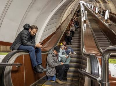 People shelter inside a subway station during a Russian missile attack in Kyiv. Reuters