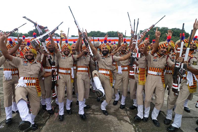 Punjab state police officers celebrate after winning the trophy for overall best march past, at an event marking Independence Day in Chandigarh, capital of the northern states of Punjab and Haryana. AFP