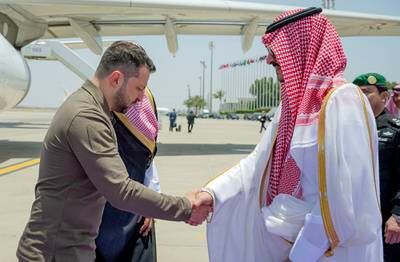 Prince Badr greeting Mr Zelenskyy in Jeddah. EPA