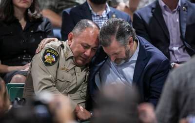 Uvalde County Sheriff Ruben Nolasco is comforted by Senator Ted Cruz during a vigil at the Uvalde County Fairplex Arena. AP