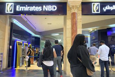 DUBAI, UNITED ARAB EMIRATES , September 13 – 2020 :- People wearing protective face mask as a preventive measure against the spread of coronavirus and waiting for their turn at the Emirates NBD bank at Ibn Battuta Mall in Dubai.  (Pawan Singh / The National) For News/Stock