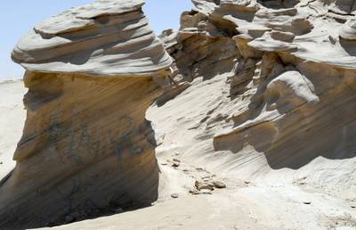 Abu Dhabi, United Arab Emirates - Graffiti vandalism near the entrance of the ancient rock formations attraction in the outskirts desert area, at Al Wathba. Khushnum Bhandari for The National