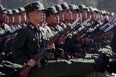 Korean People's Army (KPA) soldiers march during a mass rally on Kim Il Sung square in Pyongyang.  AFP
