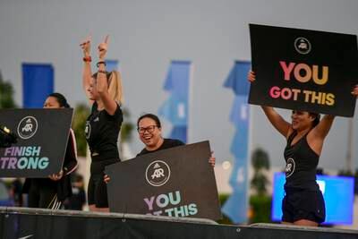 People cheer on participants at the Adnoc Abu Dhabi Marathon. 