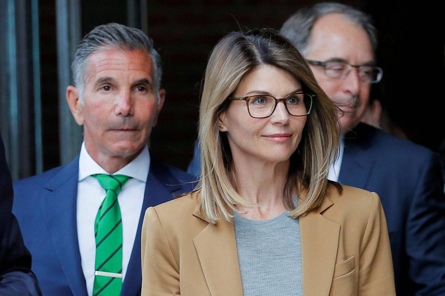 FILE PHOTO: Actor Lori Loughlin, and her husband, fashion designer Mossimo Giannulli, leave the federal courthouse after facing charges in a nationwide college admissions cheating scheme, in Boston, Massachusetts, U.S., April 3, 2019. REUTERS/Brian Snyder/File Photo