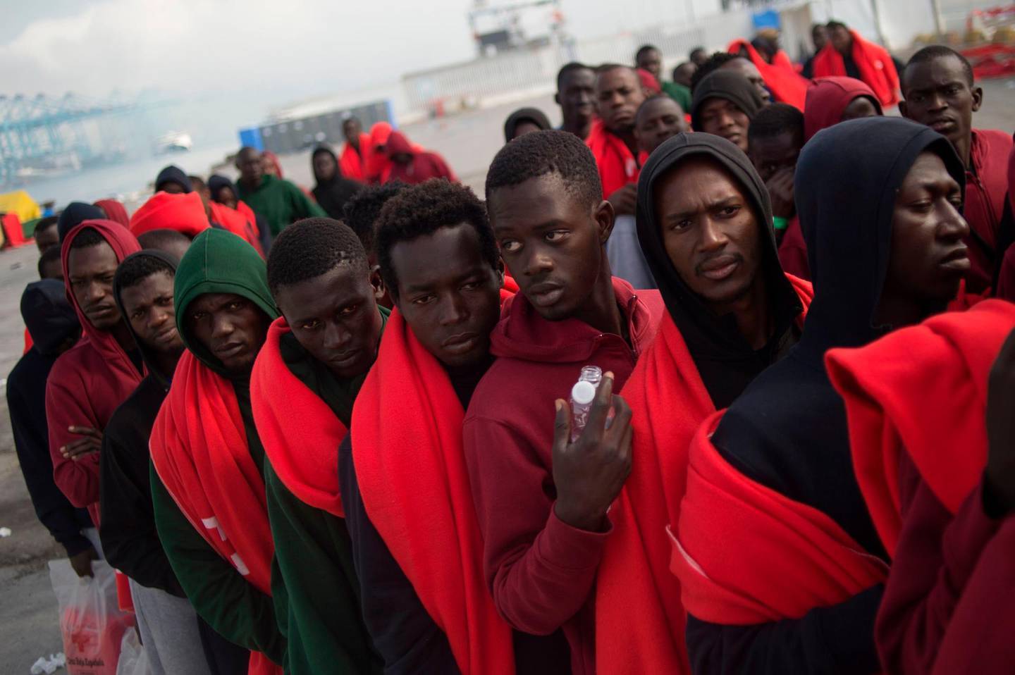 TOPSHOT - Migrants rescued at sea wait to be transferred at the harbour of Algeciras on August 1, 2018. 
Spain has overtaken Italy as the preferred destination for migrant arrivals in Europe this year as a crackdown by Libyan authorities has made it more difficult for them to reach Italian shores.  / AFP PHOTO / JORGE GUERRERO
