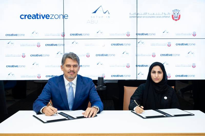 Added's SME sector chief Mouza Al Nasiri, right, and Creative Zone chief executive Lorenzo Jooris during the signing ceremony. Photo: Added