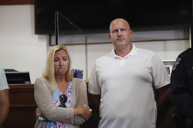 Her parents Tara and Joe Petito listen as police chief Todd Garrison leads a press conference updating the situation surrounding their missing daughter. AFP