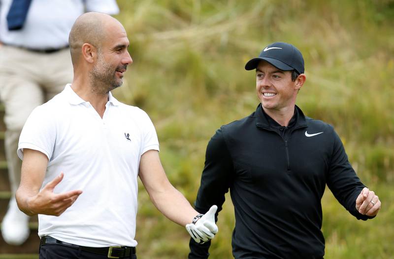 Northern Ireland's Rory McIlroy shares a joke with Manchester City manager Pep Guardiola during the pro-am at the Irish Open.