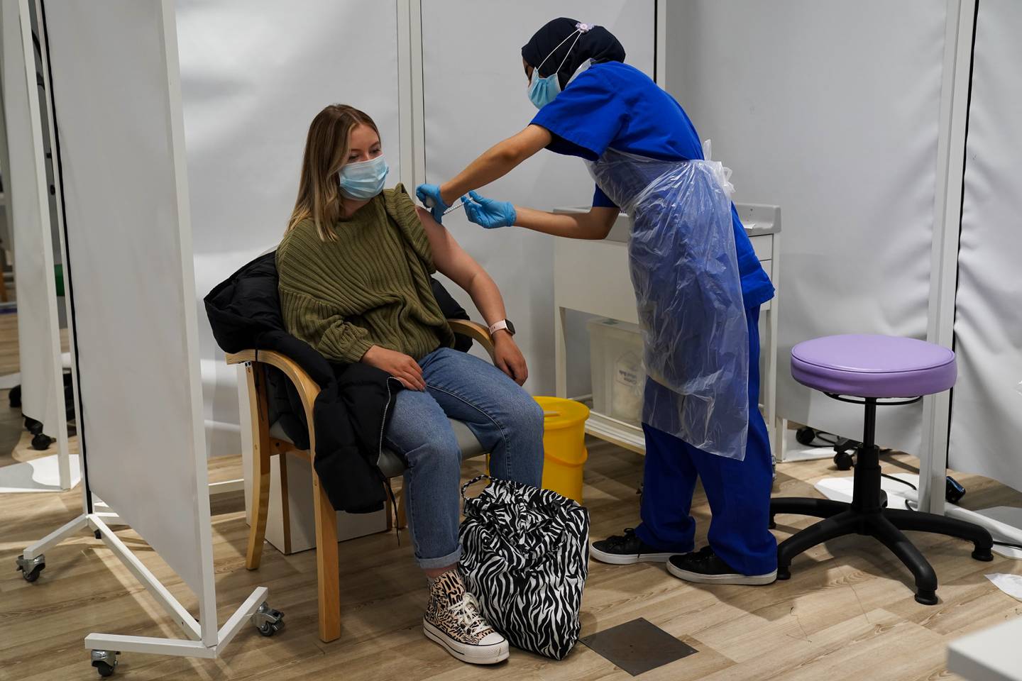 A person receives a Covid-19 Pfizer jab at a pop-up vaccination centre at Westfield Stratford City shopping centre in east London, where TikTok are encouraging young Londoners to get jabbed. Picture date: Saturday October 2, 2021.