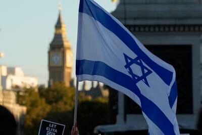 Israeli flags and placards during a protest in support of Israel in London. AP