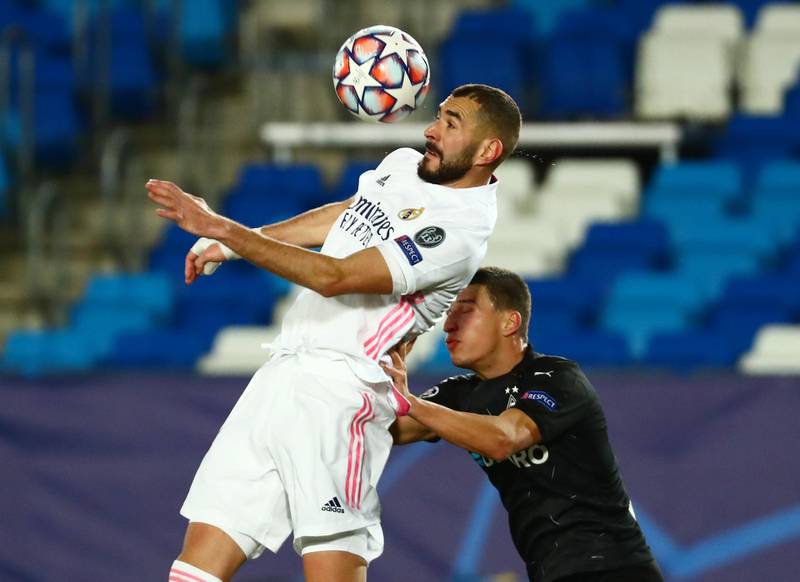 Real Madrid's Karim Benzema wins a header. Reuters