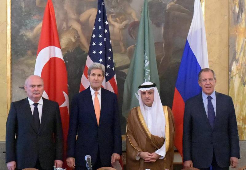 Turkish foreign minister Feridun Sinirloglu (L-R), US secretary of state John Kerry, Saudi foreign minister Adel Al Jubeir, and Russian foreign minister Sergei Lavrov pose for a photo during their meeting to discuss Syria at the Imperial Hotel in Vienna. Eduard Pesov/Handout/EPA