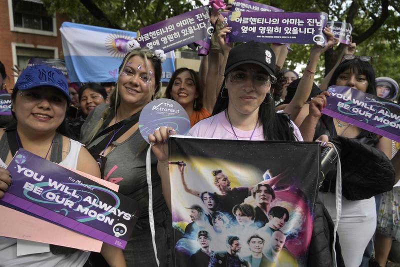 BTS fans show off their signs ahead of the concert. 