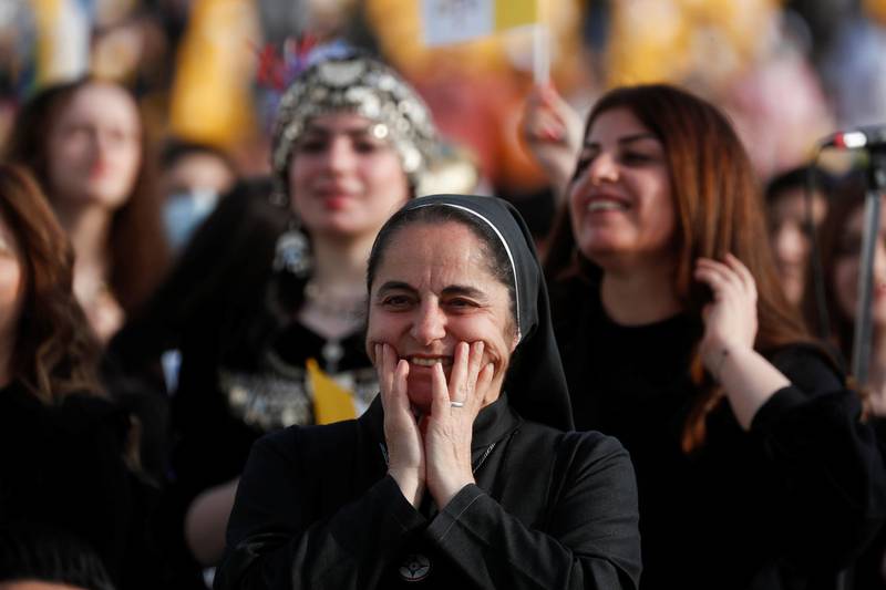 A faithful waits for Pope Francis to hold Mass at Franso Hariri Stadium in Erbil. Reuters