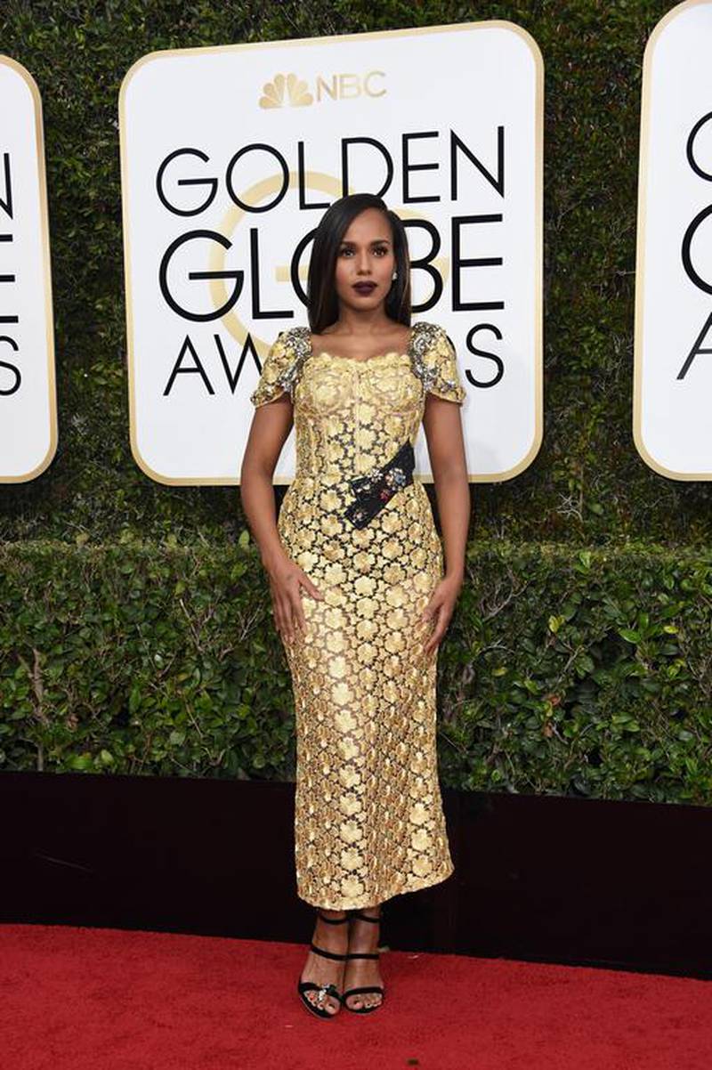 Kerry Washington wore a glimmering gold lace column dress. The decorated buckle was overkill but we’re still giving the overall look a thumbs up. Valerie Macon / AFP