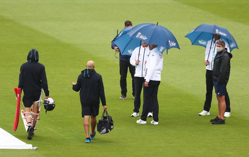 LONDON, ENGLAND - JUNE 04: Umpires Mike Burns, Richard Kettleborough and Michael Gough speak to MCC Head Groundsman Karl McDermott and Trent Boult of New Zealand during an inspection as play is delayed due to rain on Day 3 of the First LV= Insurance Test Match between England and New Zealand at Lord's Cricket Ground on June 04, 2021 in London, England. (Photo by Michael Steele/Getty Images)