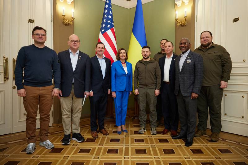 Mr Zelenskyy and Ms Pelosi pose for a picture with members of their delegations in Kyiv. AFP /  Ukrainian Presidential Press Service