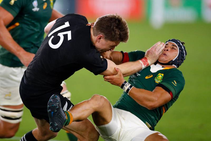 New Zealand's full back Beauden Barrett (L) attempts to run past South Africa's wing Cheslin Kolbe during the Japan 2019 Rugby World Cup Pool B match between New Zealand and South Africa at the International Stadium Yokohama in Yokohama.  AFP