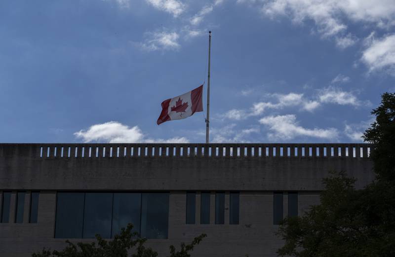 The Canadian flag flies at half-staff over the Canadian Embassy in Washington, Thursday, September 8, 2022, after Queen Elizabeth II, Britain's longest-reigning monarch and a rock of stability across much of a turbulent century, died Thursday after 70 years on the throne. AP