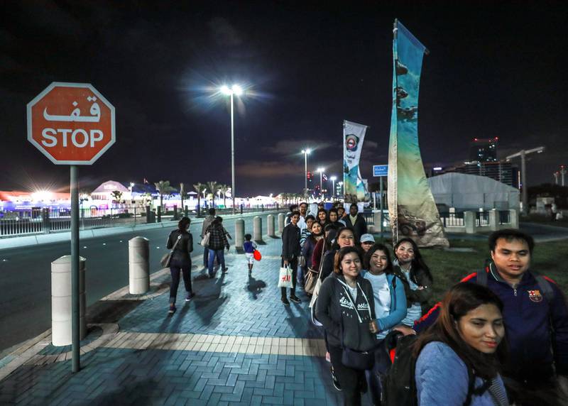 Abu Dhabi, U.A.E., February 5, 2019.   Worshipers heading onto buses at Nation Towers before they're transported to the mass.Victor Besa/The NationalSection:  NAReporter: