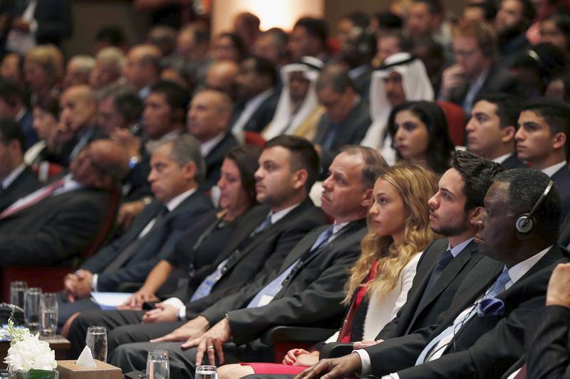 Jordan's Crown Prince Hussein, second from right, Princess Iman, third from right, and Prince Faisal, fourth from right, attend the Global Forum on Youth Peace and Security at the King's Academy school in Madaba city, in August 2015. Reuters