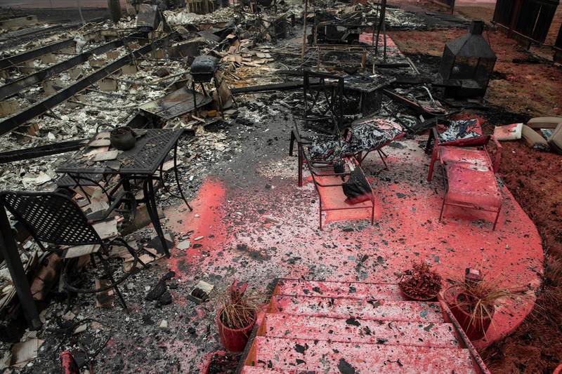 Charred furniture in a home destroyed by fire. AP Photo