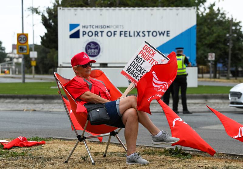 A worker protests outside the entrance to the port at Felixstowe. Reuters