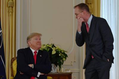 US President Donald Trump speaks with US acting Chief of Staff Mick Mulvaney after his meeting with Nato Secretary General Jens Stoltenberg at Winfield House, London. AFP