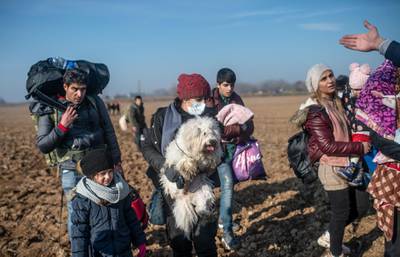 Migrants walk towards the Greek border in Pazarkule, in the Edirne district. AFP