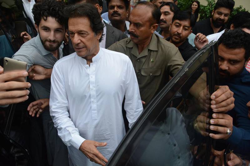 epa06930734 Imran Khan (L), head of Pakistan Tehrik-e-Insaf political party leaves after attending the party's parliamentary board session in Islamabad, Pakistan, 06 August 2018. PTI parliamentary board nominated Imran Khan as the party's candidate for the Prime Minister. Former cricketer Imran Khan's Pakistan Tehreek-e-Insaf has emerged as the biggest party, securing 116 of the 272 seats in the National Assembly, according to the Election Commission of Pakistan.  EPA/T. MUGHAL