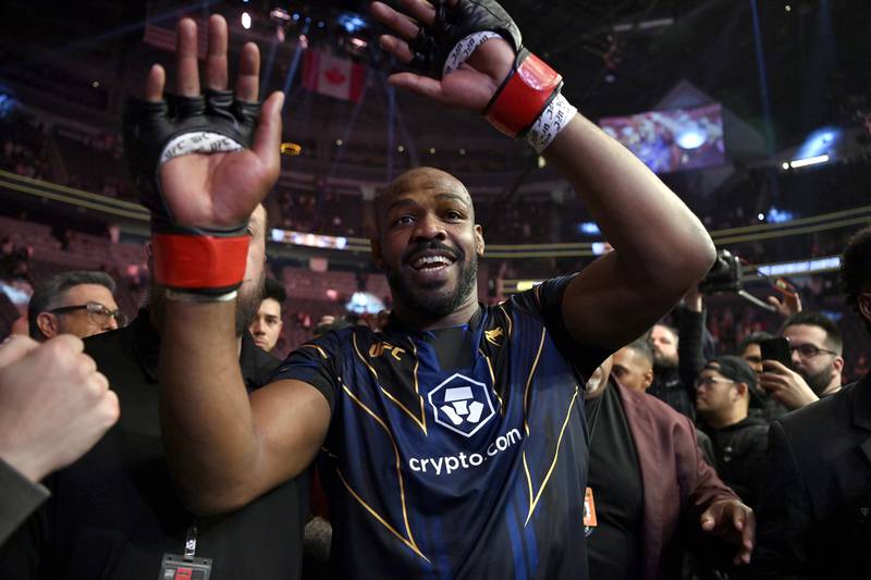 Jon Jones celebrates his victory over Ciryl Gane as he walks from the octagon after the UFC 285 mixed martial arts heavyweight title bout Saturday, March 4, 2023, in Las Vegas.  (AP Photo / David Becker)