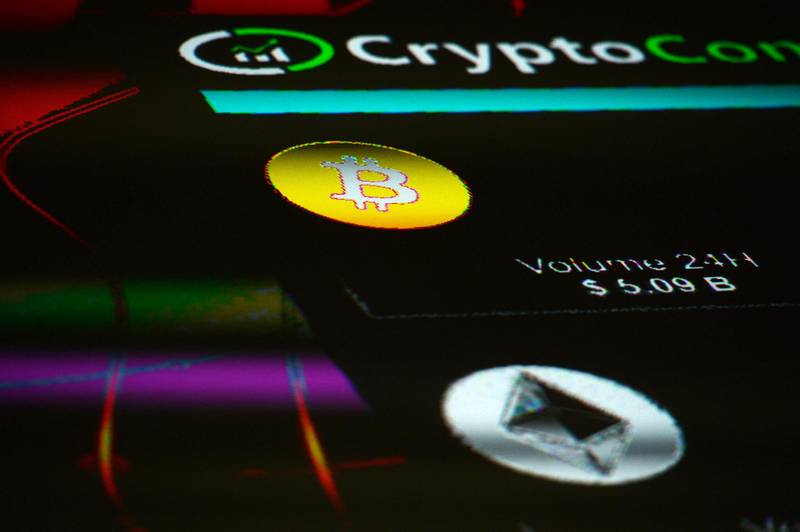 The symbols for Bitcoin and Ethereum cryptocurrency sit displayed on a screen during the Crypto Investor Show in London, U.K., on Saturday, March 10, 2018. The meeting is the largest crypto and blockchain event for investors in the U.K. Photographer: Mary Turner/Bloomberg