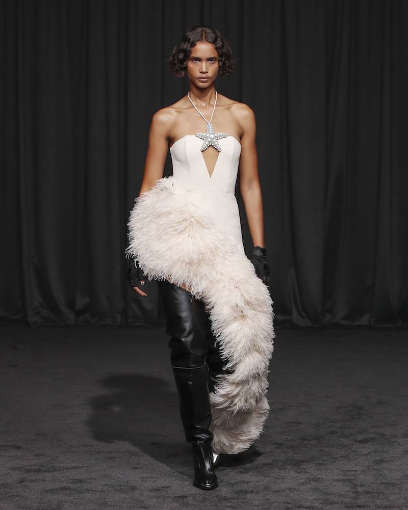 Glamour with an edge, as feathers mix with leather boots at David Koma. Photo: David Koma