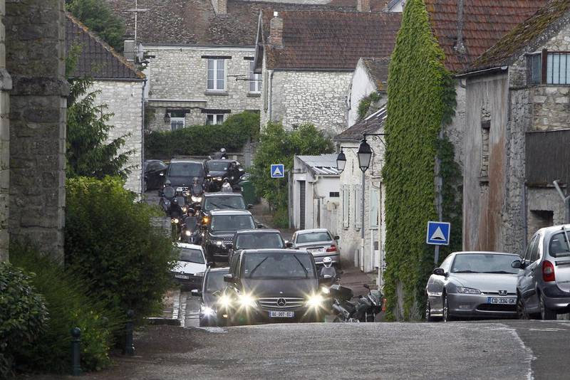 The cars of Kim Kardashian, Kanye West and their guests arrive at the entrance of the Wideville Castle, in Davron, 35 miles west of Paris on May 23, 2014. Francois Mori / AP photo