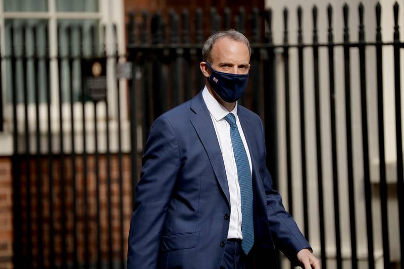Britain's Foreign Secretary Dominic Raab walks into Downing Street in London, Tuesday, April 27, 2021. (AP Photo/Matt Dunham)