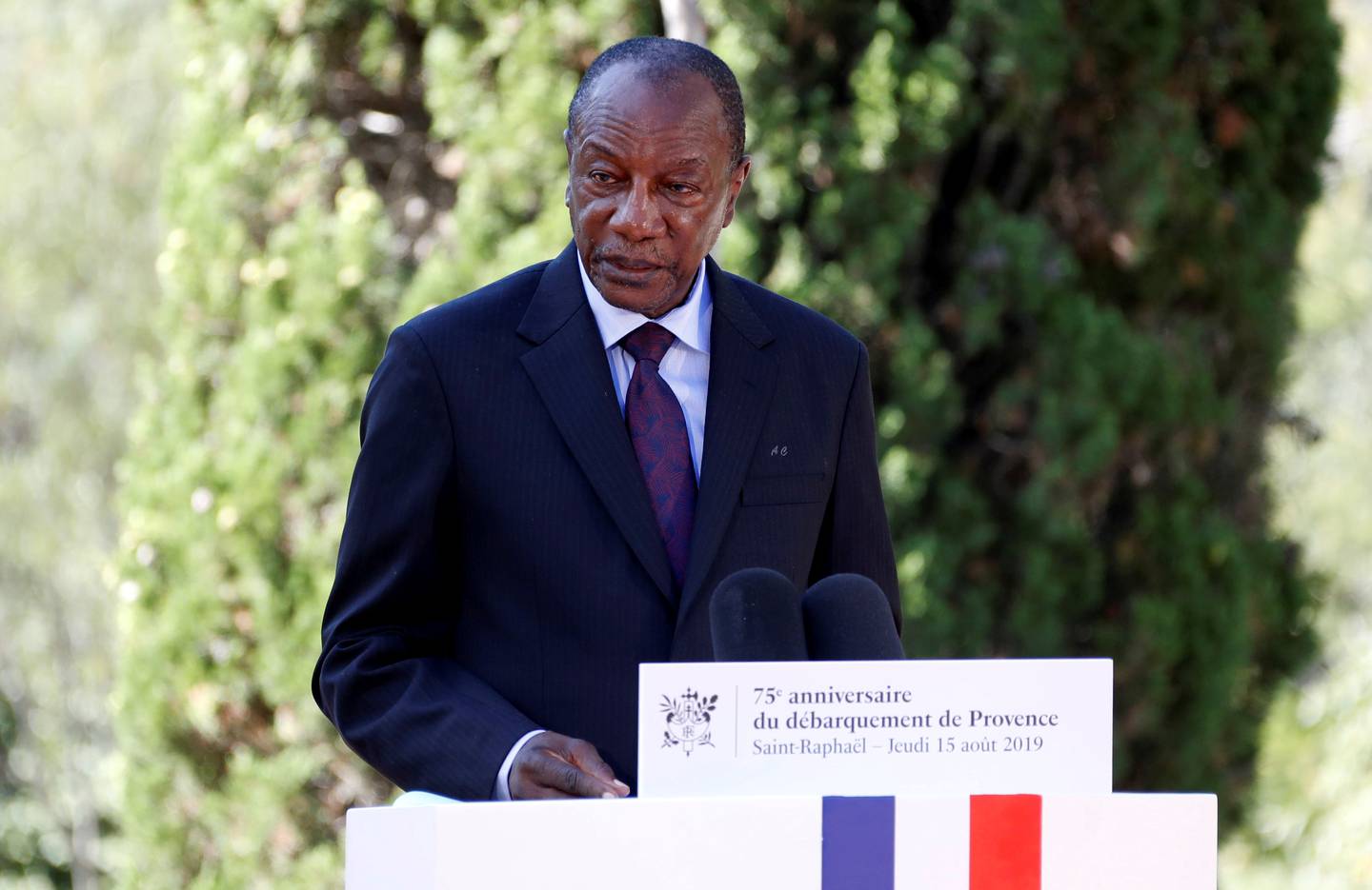 Guinean President Alpha Conde delivers a speech in Boulouris, France, on August 15, 2019 during a ceremony marking the 75th anniversary of the Allied landings in Provence in the Second World War. Reuters